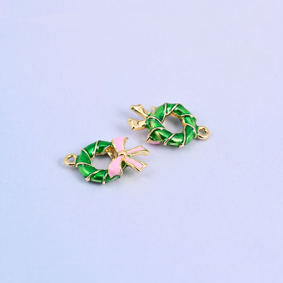 Two green wreath charms angled to show the 5.30mm thick twisted ring.