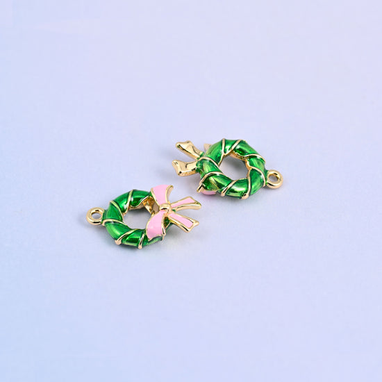 Two green wreath charms angled to show the 5.30mm thick twisted ring.