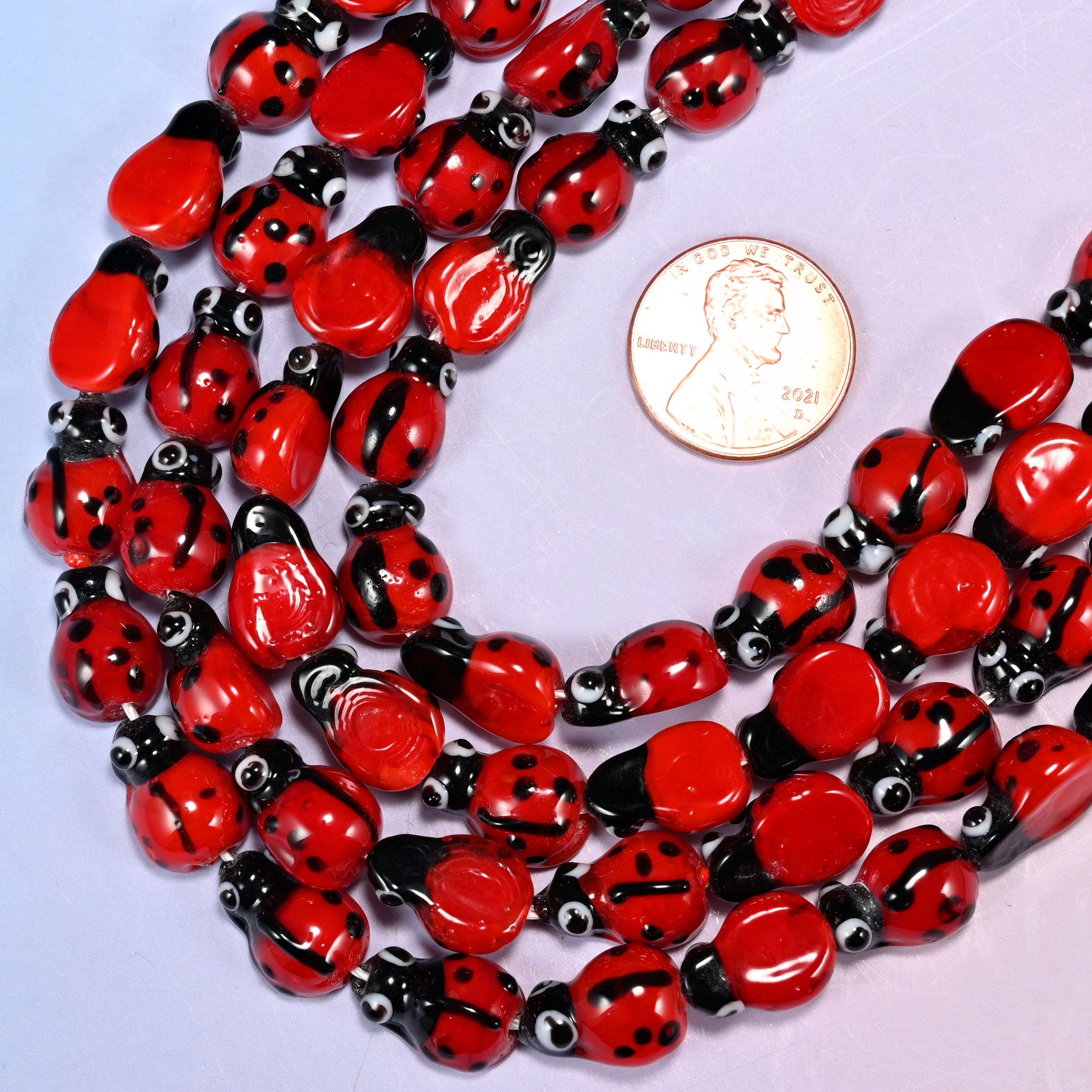 Ladybug shaped glass beads for garden and children's pieces.