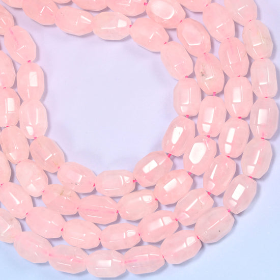 Wide circular coil of Rose Quartz faceted barrel bead strands forming a full wreath shape on a light lavender background.