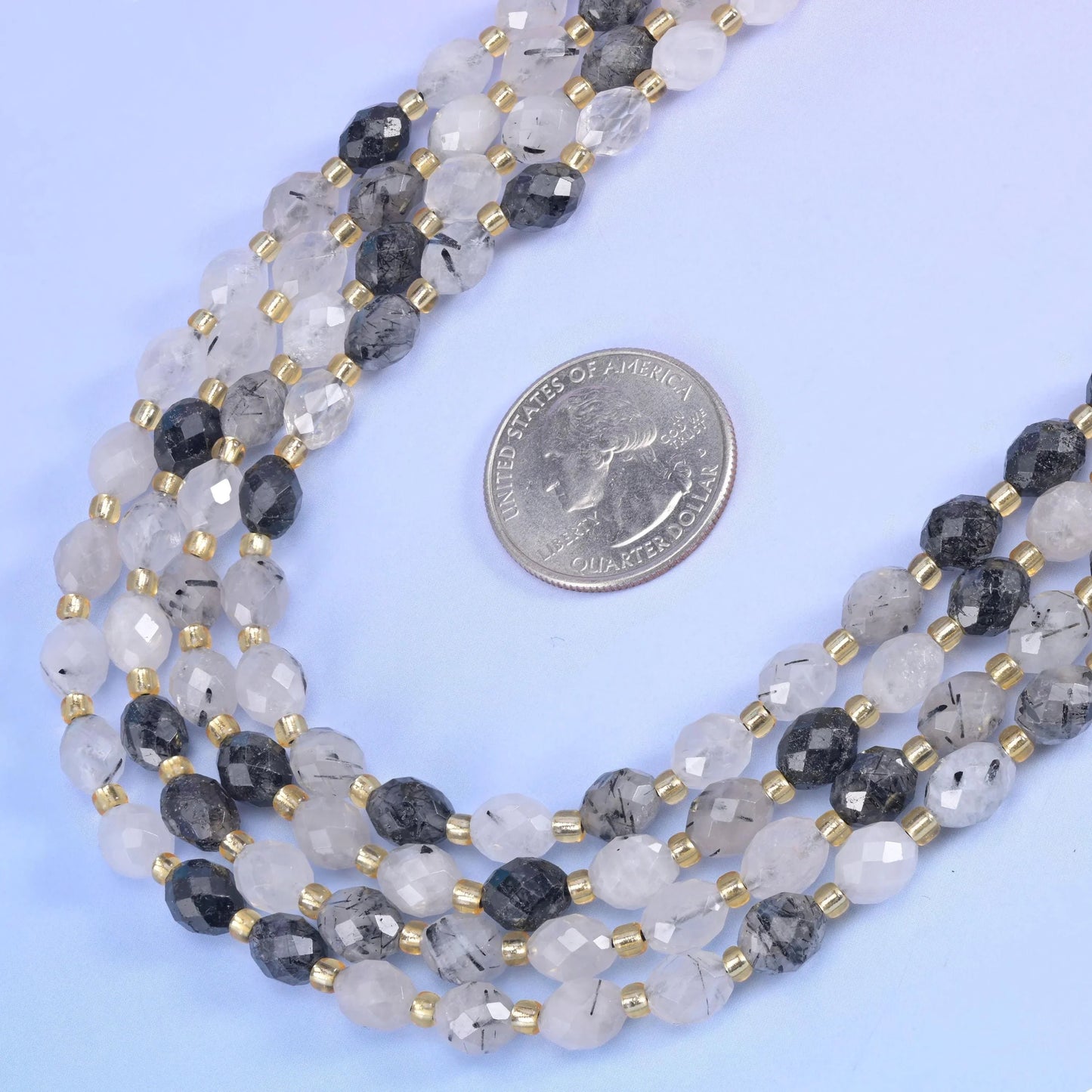 Black Rutilated Quartz Faceted Rice Barrel Beads 6x8mm in clear to frosted white with black needle inclusions