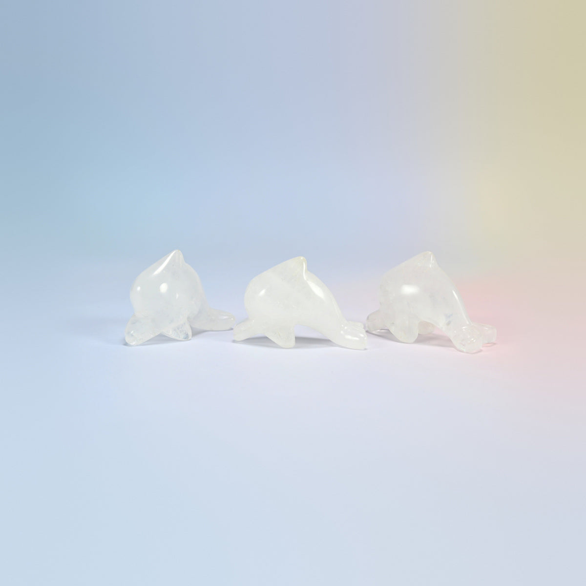 Three clear quartz dolphin crystal carvings, 2 inch, milky clear natural stone