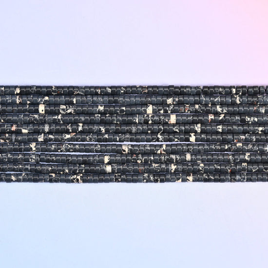 Black Sea Sediment Jasper Heishi Disc Beads 2x4mm in black with cream and white marbling