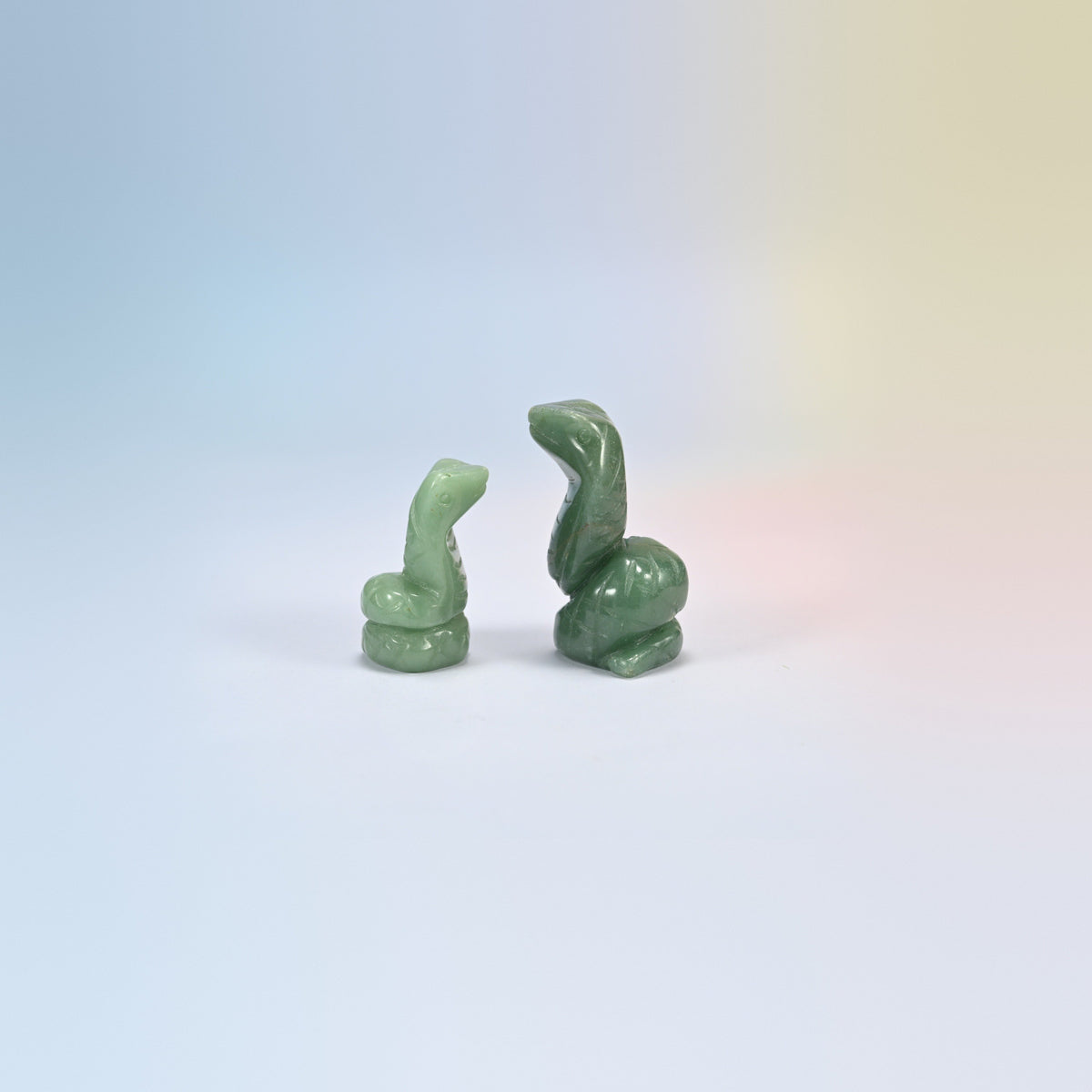Cobra snake crystal carving in green aventurine, soft green natural stone