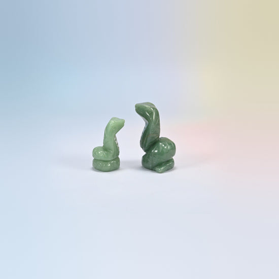 Cobra snake crystal carving in green aventurine, soft green natural stone