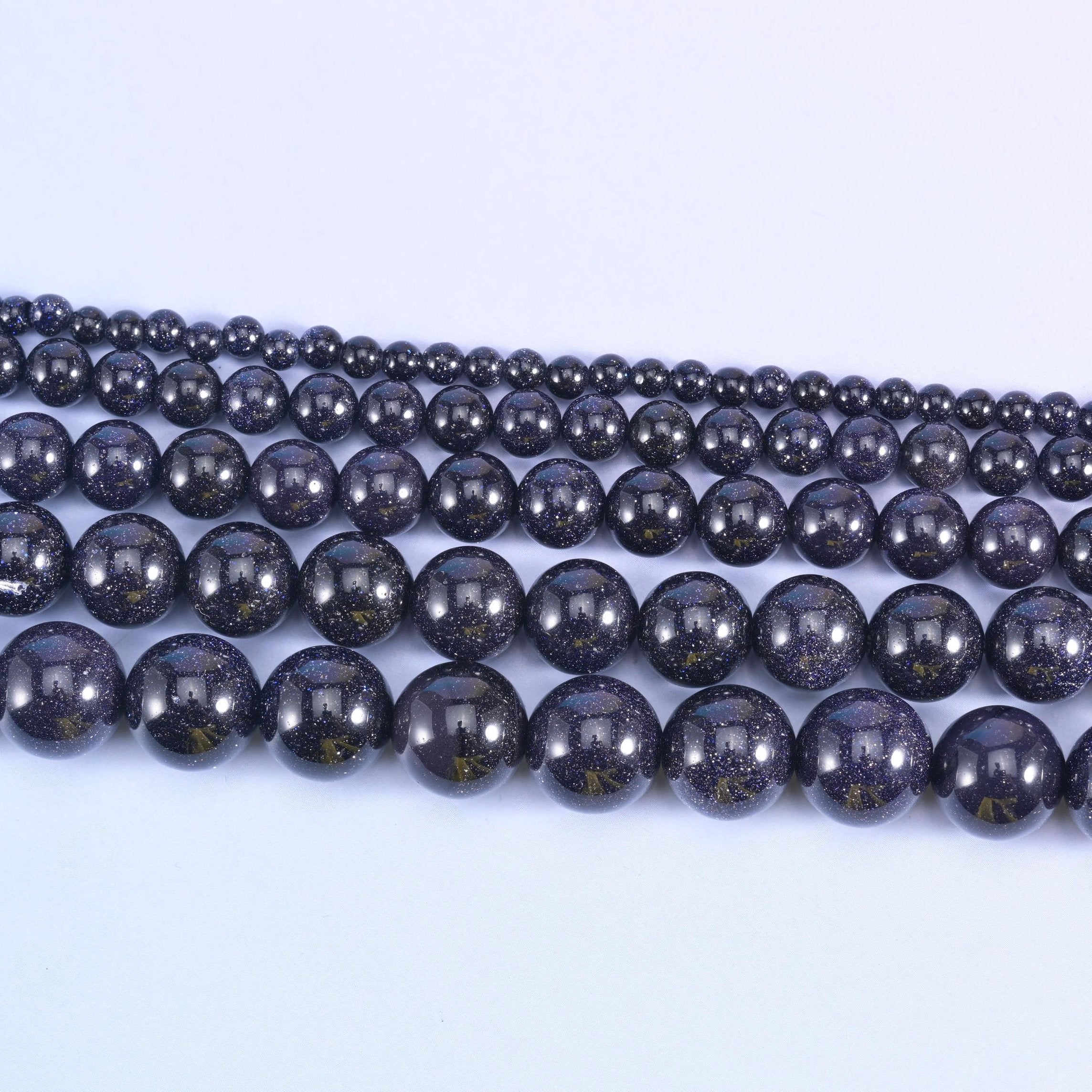 Blue Sandstone Smooth Round Beads 6mm 8mm 10mm 12mm in midnight navy with copper-gold flecks