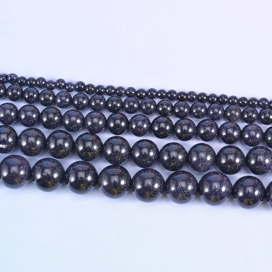 Blue Sandstone Smooth Round Beads 6mm 8mm 10mm 12mm in midnight navy with copper-gold flecks