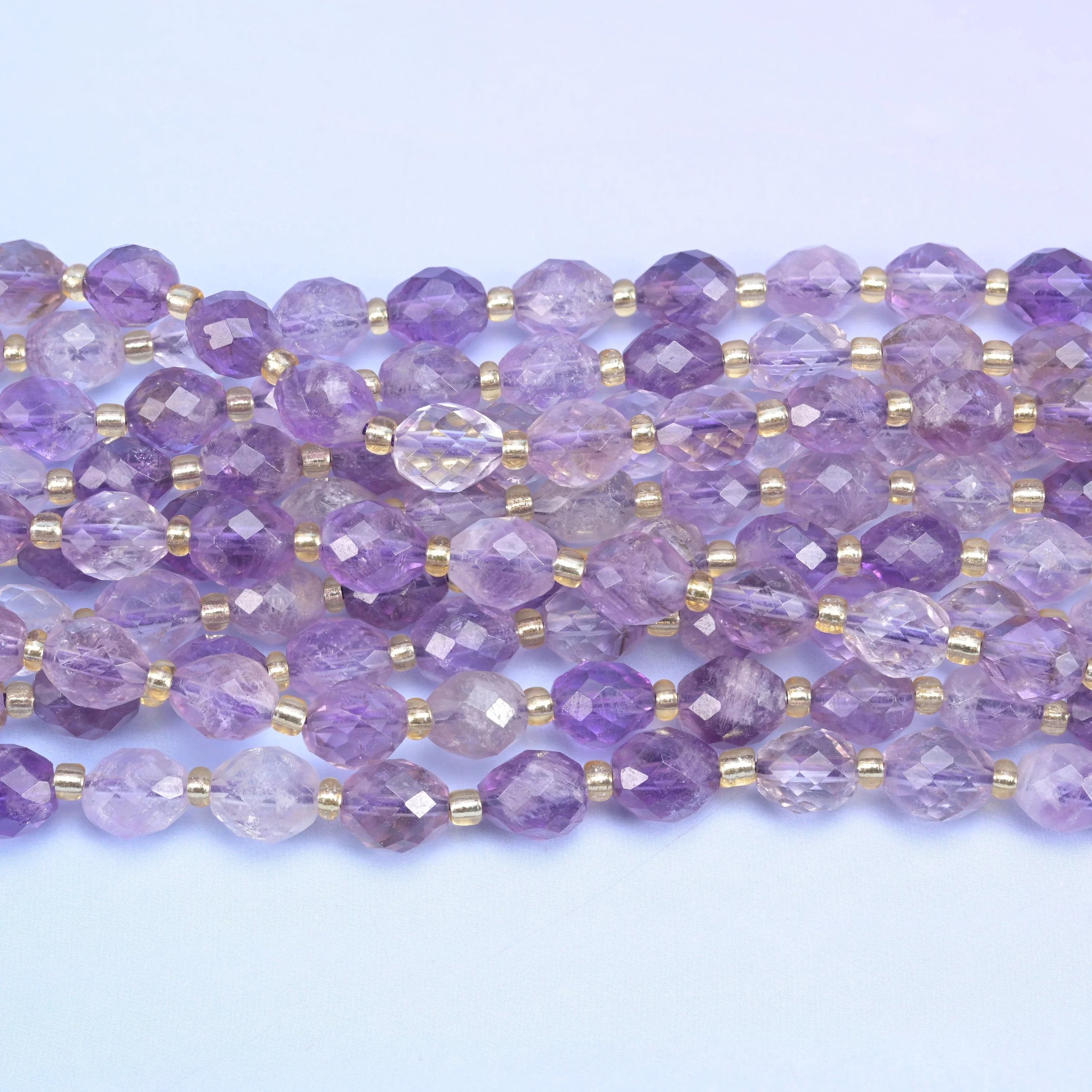 Faceted rice barrel cut amethyst rutilated quartz beads