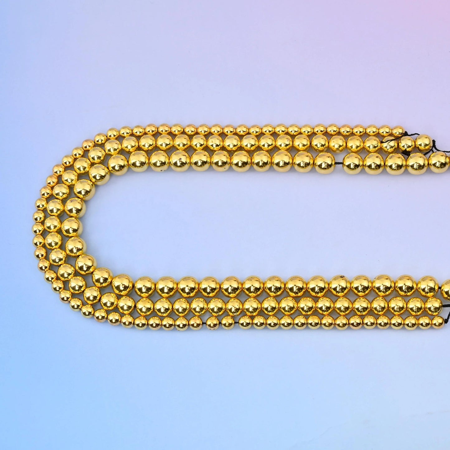 Titanium Gold Hematite round beads, 15.5 inch strand.