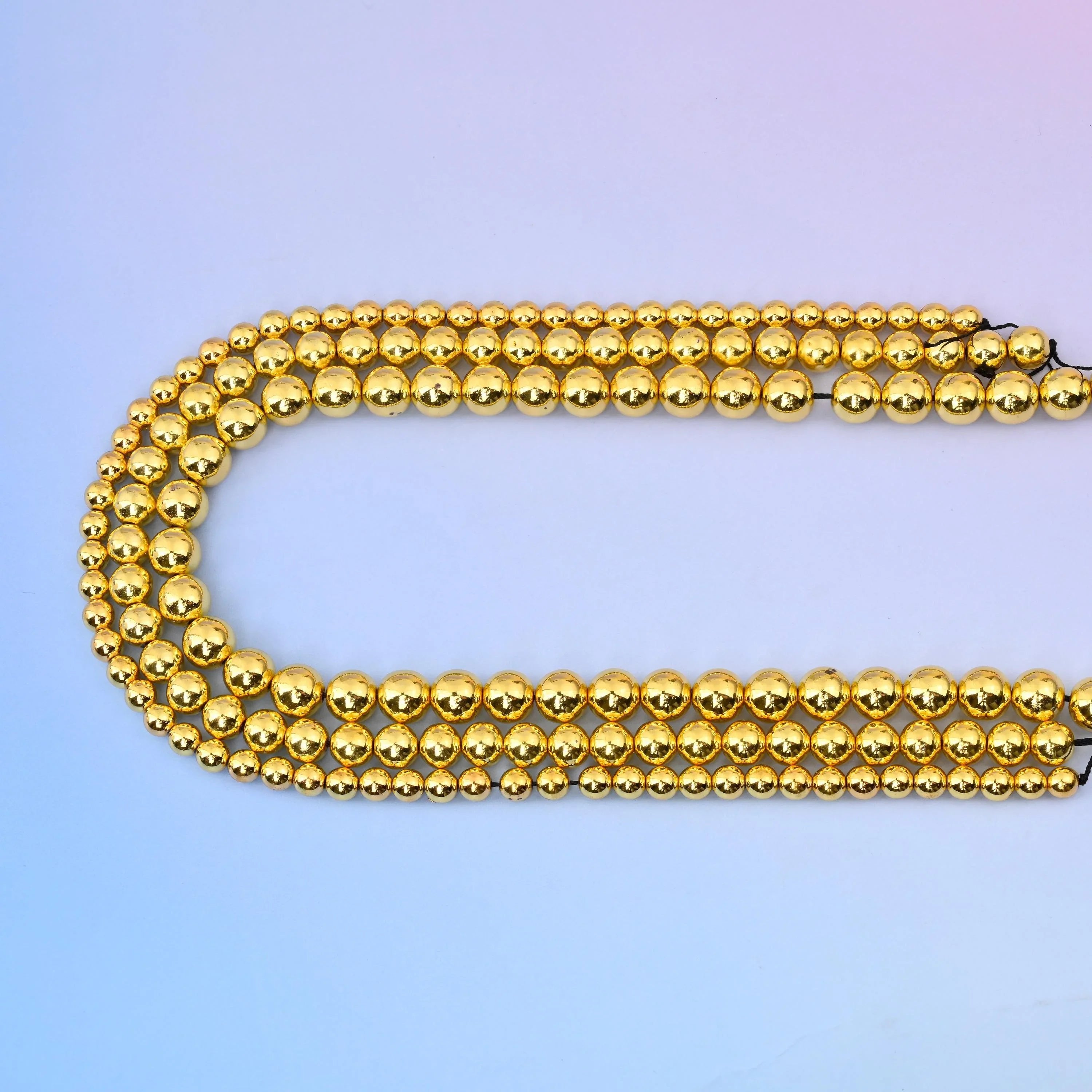 Titanium Gold Hematite round beads, 15.5 inch strand.