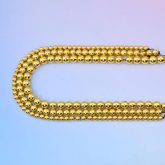 Titanium Gold Hematite round beads, 15.5 inch strand.