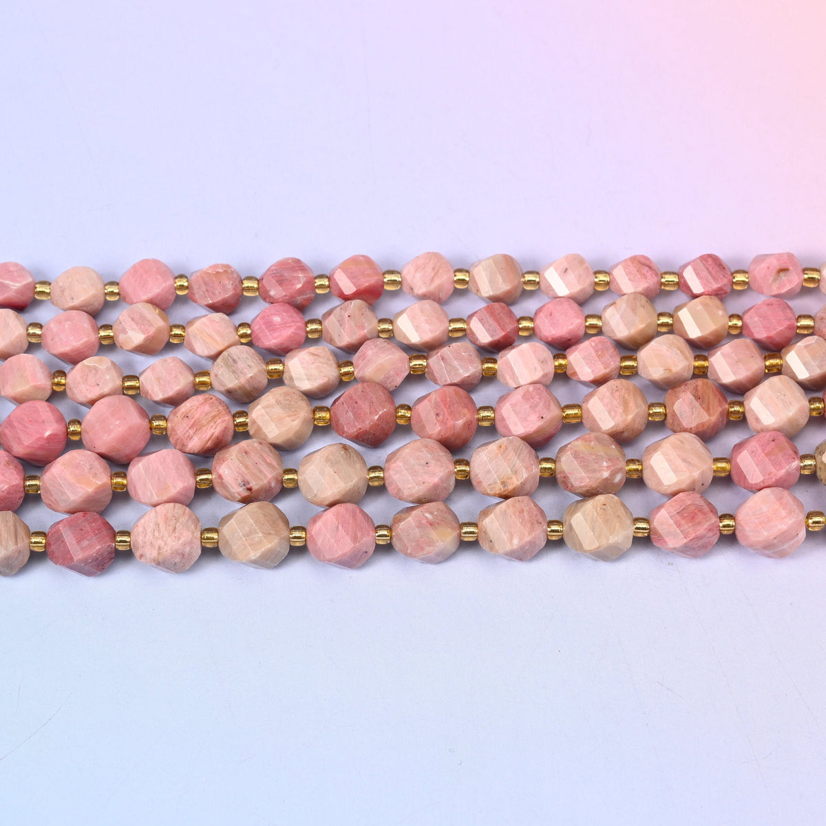 Pink Rhodonite in dusty rose and salmon pink marbled with cream and grey