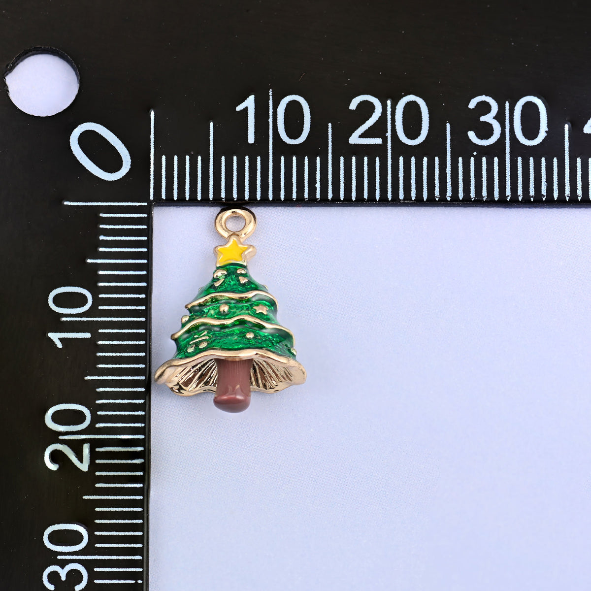 Christmas tree charm measuring 18.92 x 12.30mm, small enough for a bracelet or an earring.