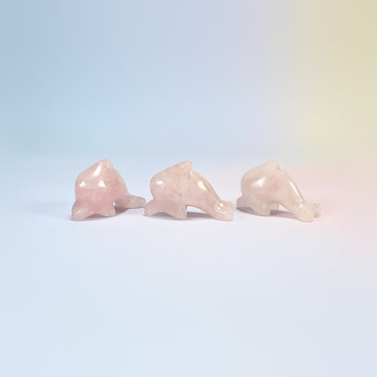 Three rose quartz dolphin crystal carvings, 2 inch, light pink natural stone