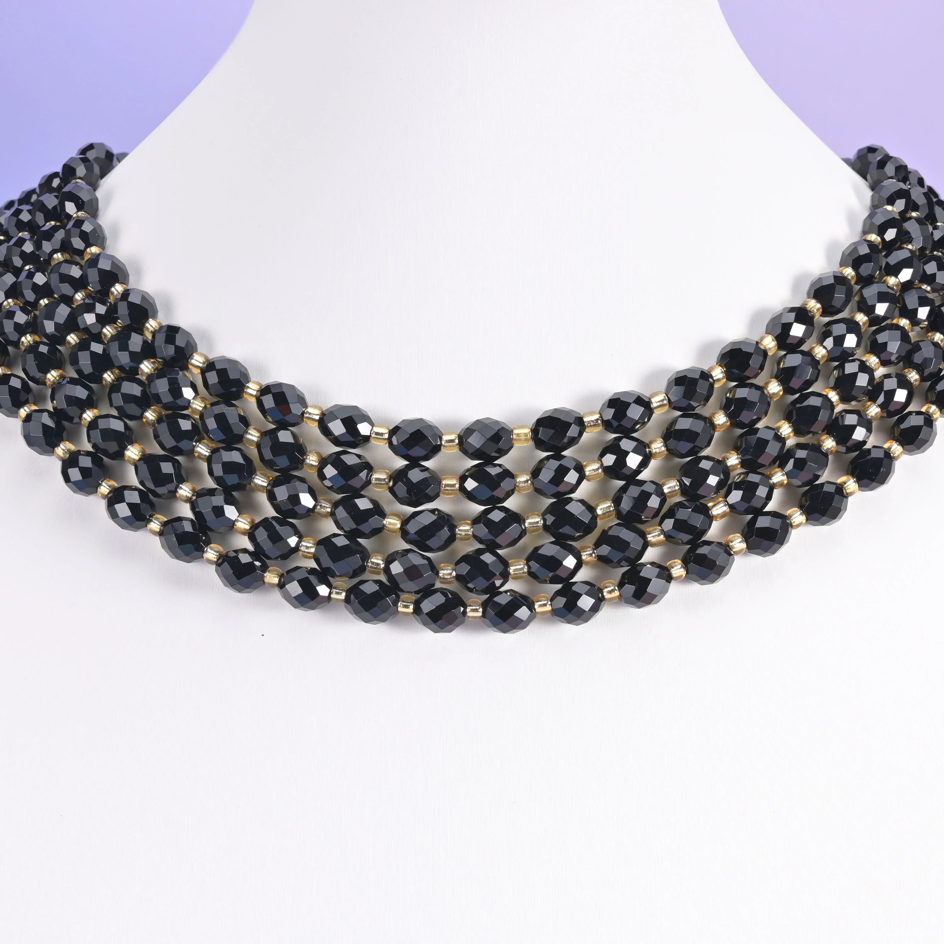 Black Onyx beads, faceted rice barrel shape, 6x8mm.