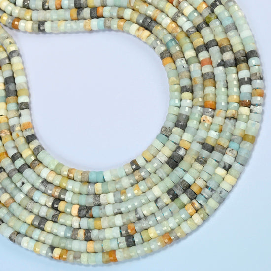 Multi-color amazonite faceted heishi disc beads curved into an open loop, blue-green, cream, yellow and gray beads