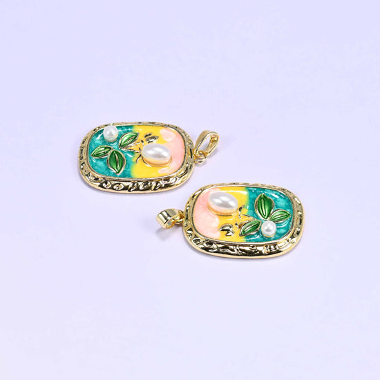 18K gold plated brass tulip charm pendant with a pink-to-teal enamel gradient background, green leaf details, and faux pearl accents.