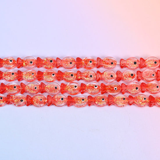 Red Fish Glass Beads with coral red heads and tails, gold glitter flecks