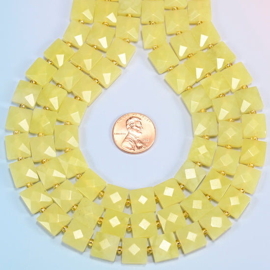 Lemon Jade faceted flat square strands formed into a teardrop loop around a US penny for scale