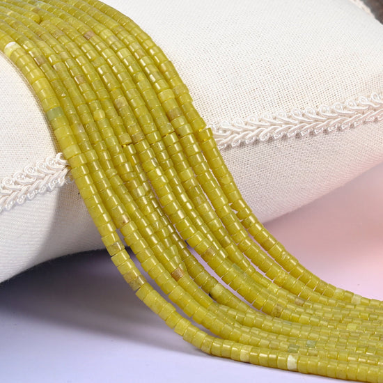 Natural Lemon Jade smooth heishi disc beads in a bright, cheerful yellow-green