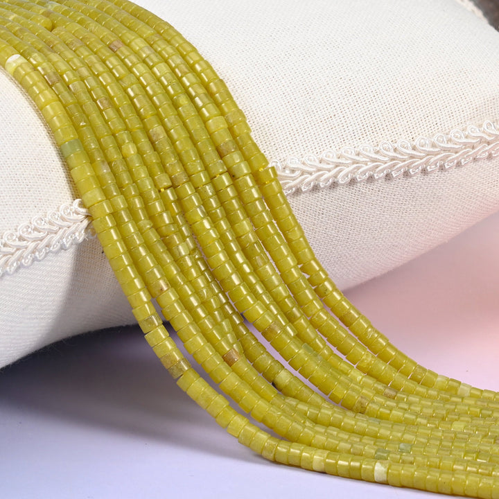 Natural Lemon Jade smooth heishi disc beads in a bright, cheerful yellow-green