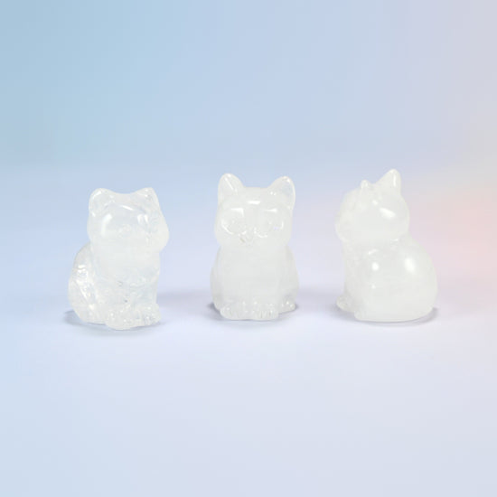 Three natural clear quartz sitting cat crystal carvings, 1.5 inch, icy clear