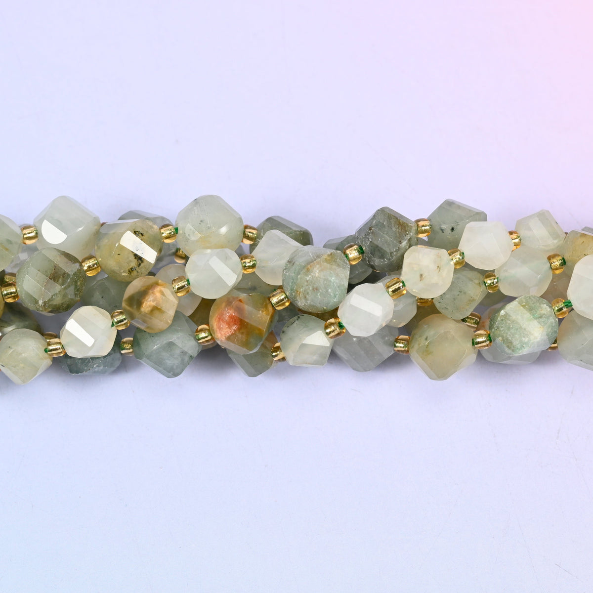Green Grass Silk Stone Faceted Spiral Twist Beads, muted sage green threaded with cream and straw, with fine fibrous streaks