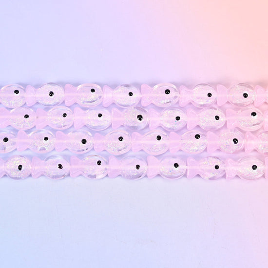 Iridescent Pink Fish Glass Beads in pale petal-pink with a pearly sheen