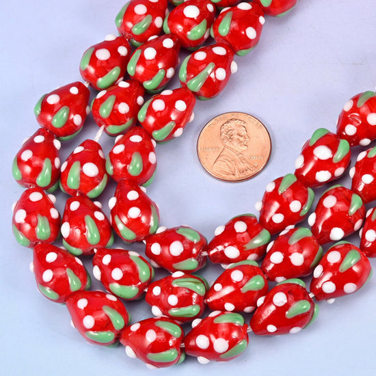 Moulded strawberry shaped red glass beads