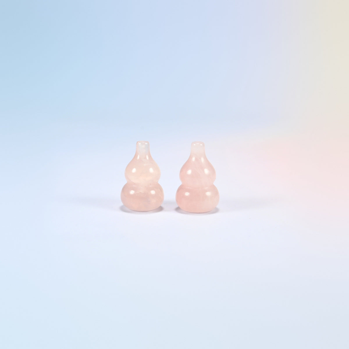 Two small natural rose quartz calabash gourd carvings standing