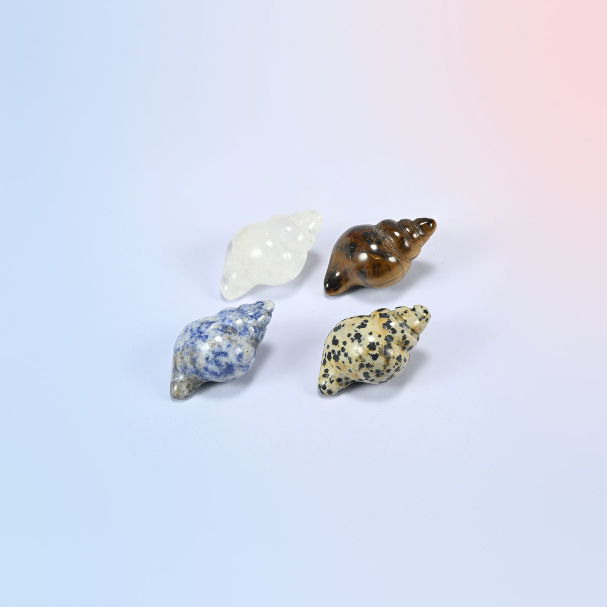 Natural clear quartz, tiger eye, blue spot jasper and dalmatian jasper conch shell crystal carvings, 1.5 inch