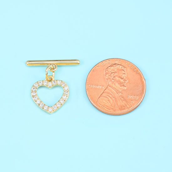 Heart shaped toggle clasp with 18K gold filled finish and set zircon stones