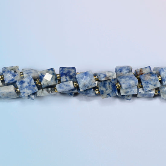 Strands of natural blue spot jasper faceted flat square beads twisted together in a horizontal row