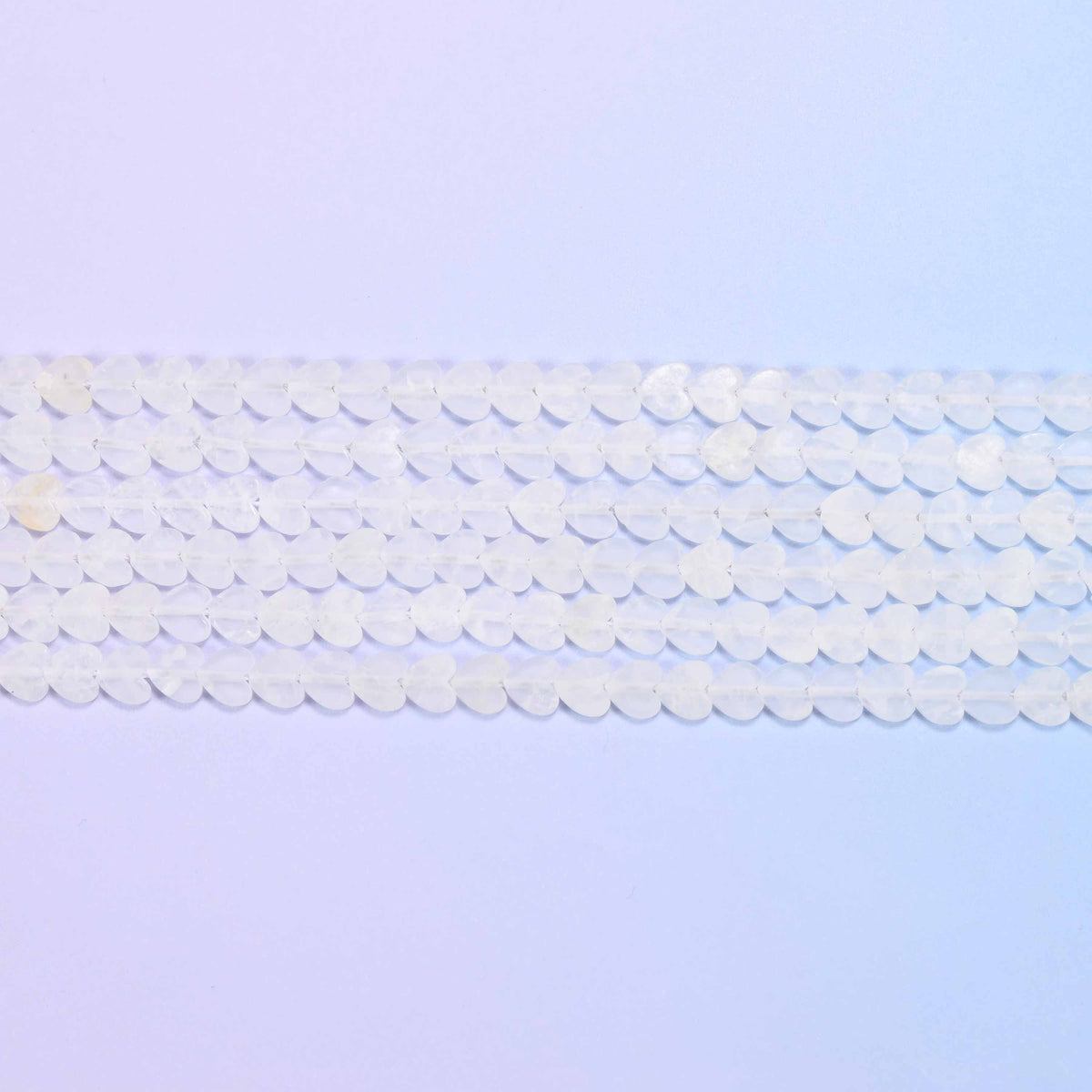 Clear quartz beads in frosted white with a soft sea-glass surface