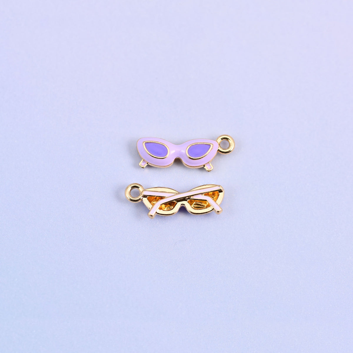 Light purple cat eye sunglasses charm with purple lenses, front and back.