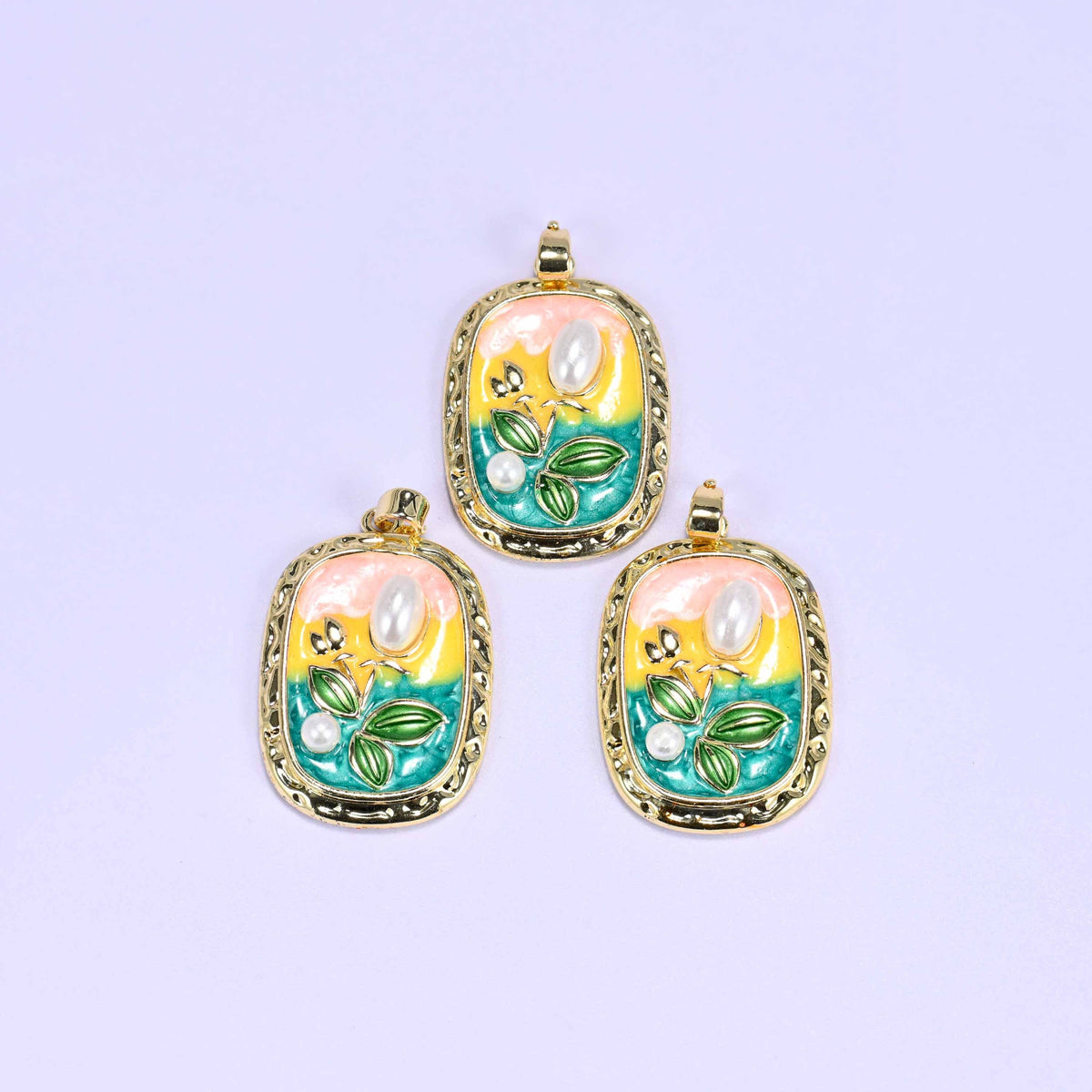 Tulip charm with a pink-to-teal enamel gradient background