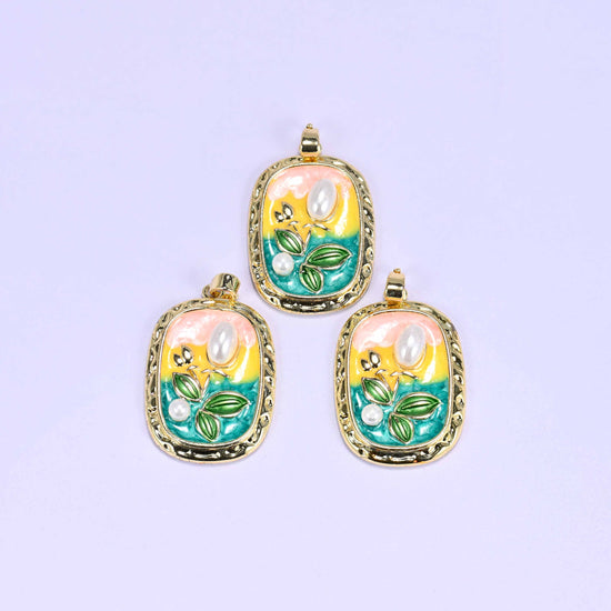 Tulip charm with a pink-to-teal enamel gradient background