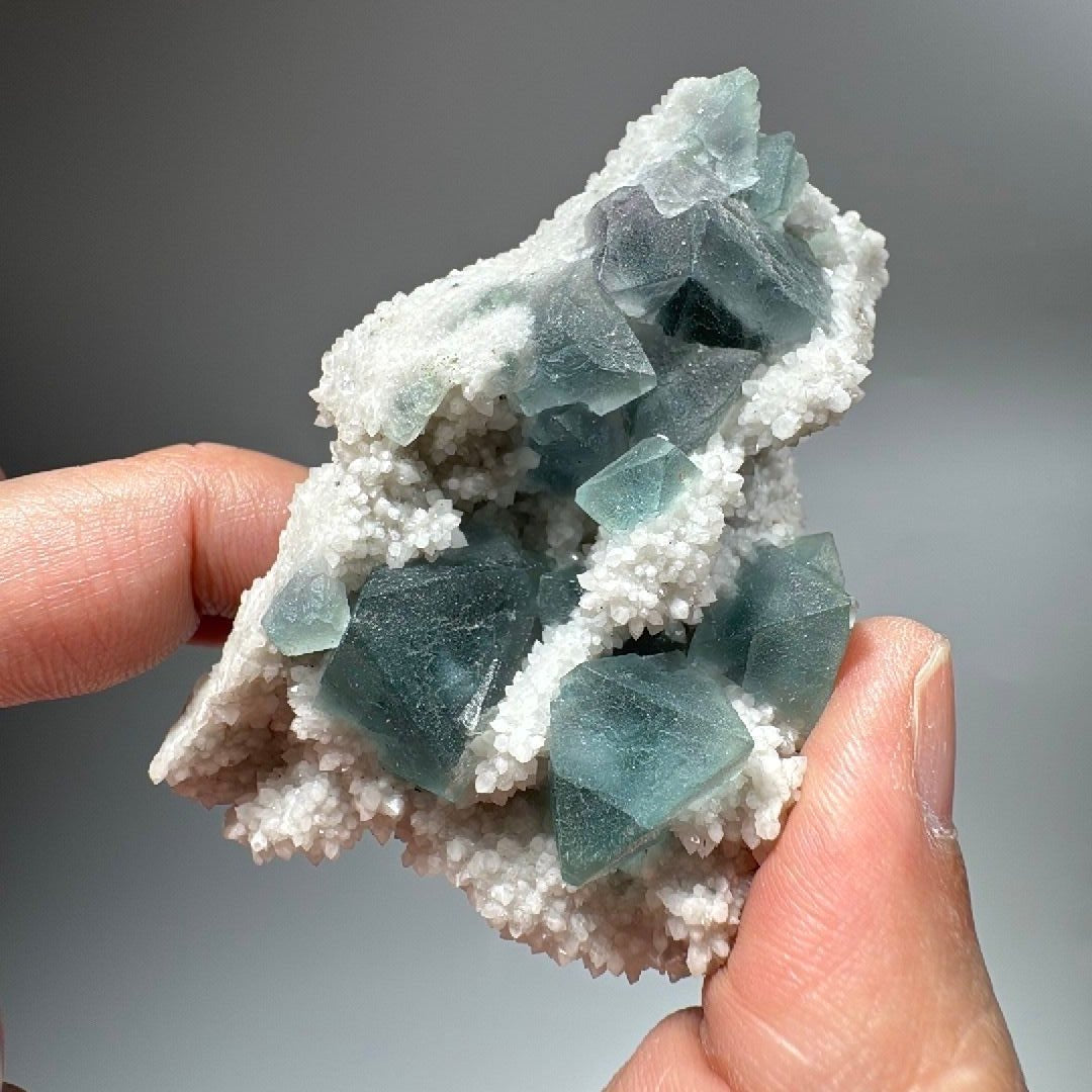 Natural uncut cubic fluorite and frosted crystal specimen