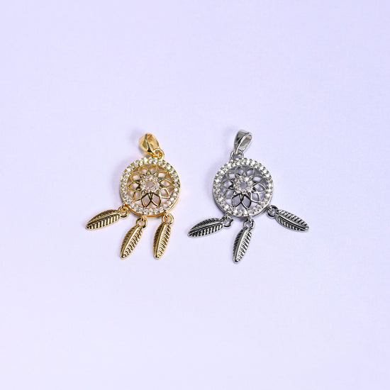 Dream Catcher Zirconia Charms colorway pair, gold plated on the left and silver tone on the right, each with an openwork medallion and feathers.