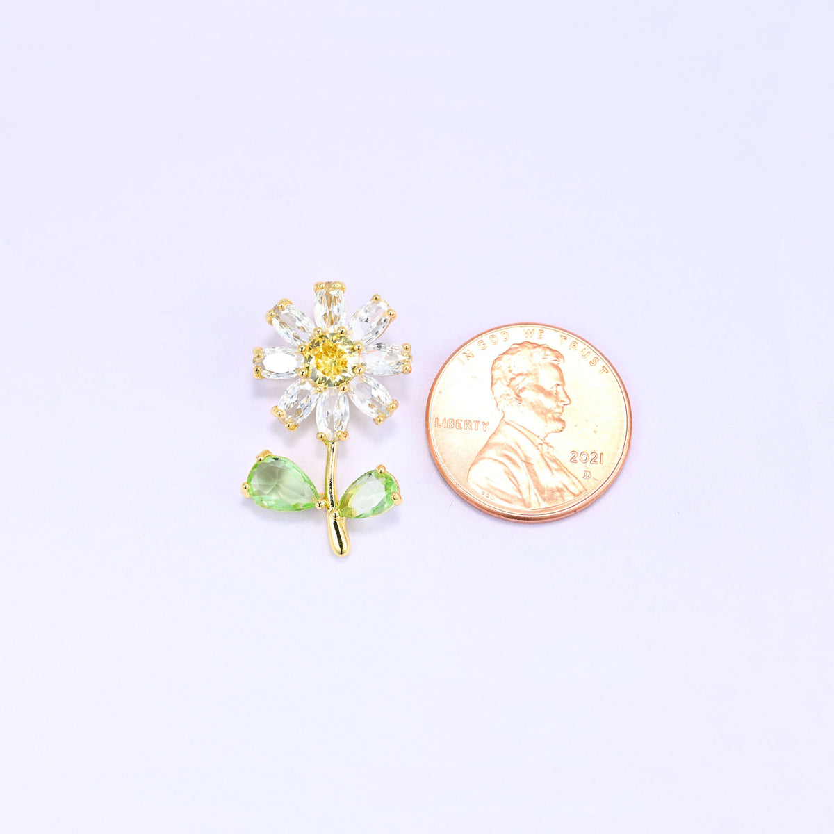 Brass daisy flower charm with sparkling zirconia accent