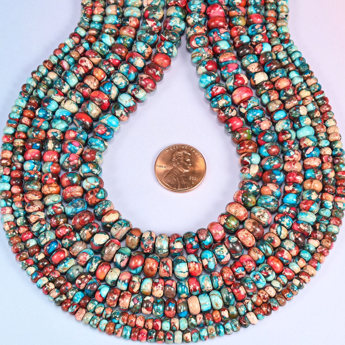 Red Dyed Sea Sediment Jasper Rondelle Beads, approximately 75 to 120 beads per strand.