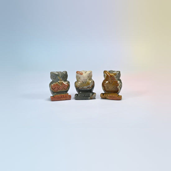 Owl crystal carving in Picasso jasper, gray and brown natural stone with dark markings