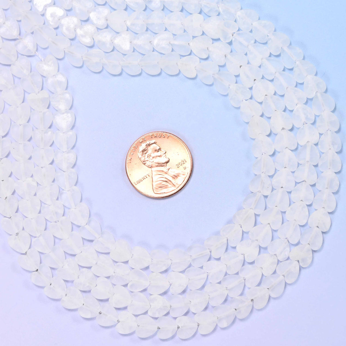 Matte clear quartz flat heart beads, approximately 68 per strand
