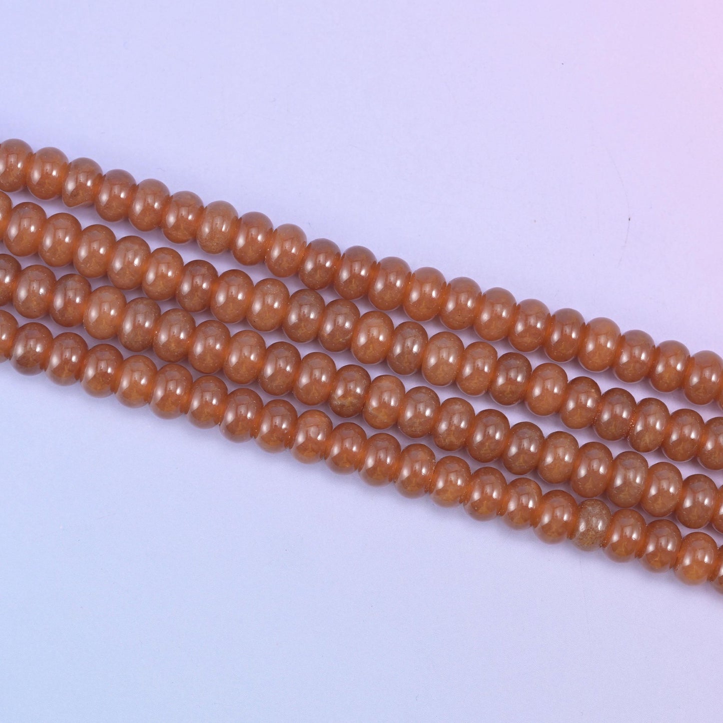 Caramel Dyed Jade beads in a warm, glossy amber-brown tone