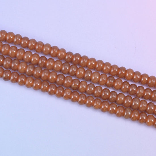 Caramel Dyed Jade beads in a warm, glossy amber-brown tone
