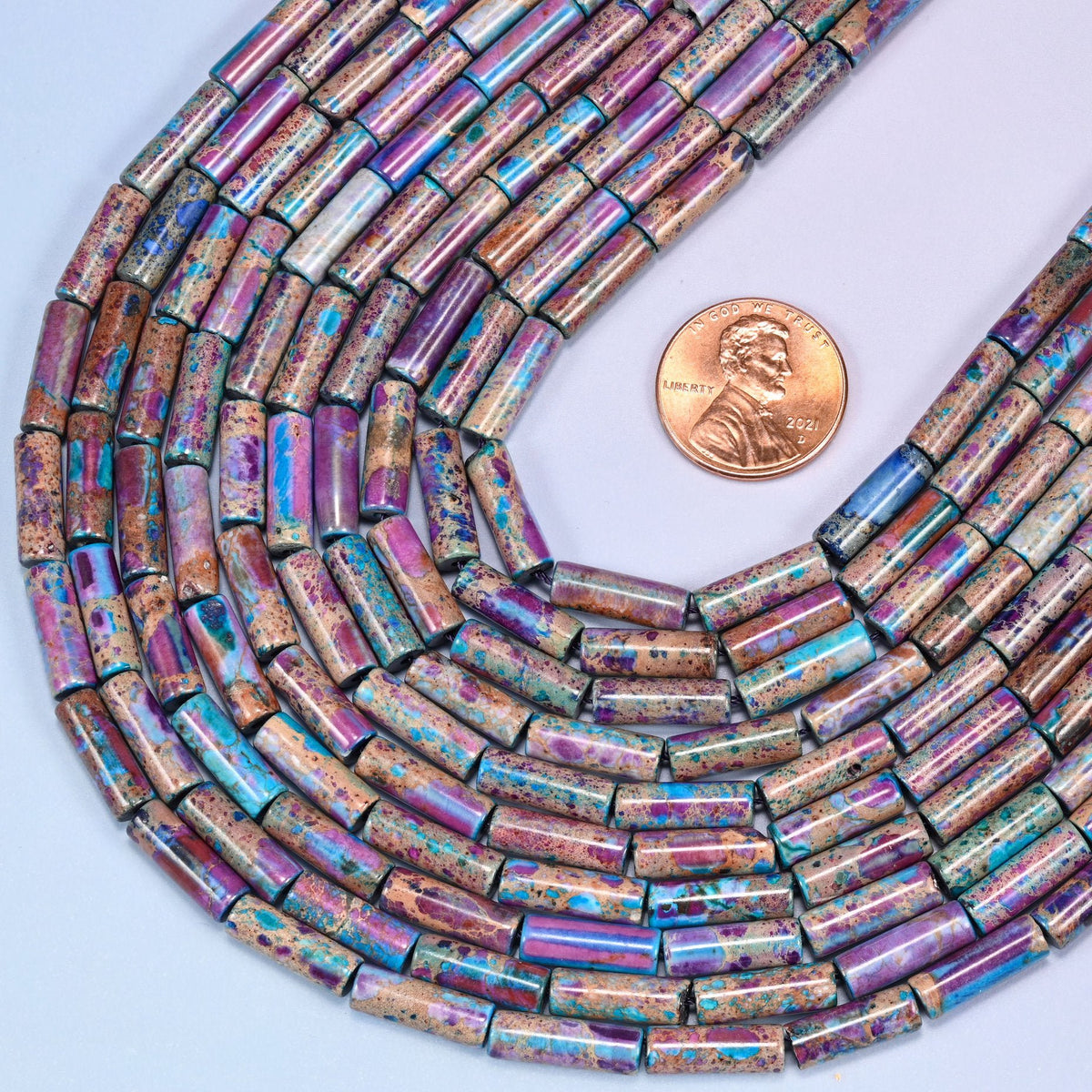 Tube cut Sea Sediment Jasper beads, dyed for vibrant multicolor saturation.