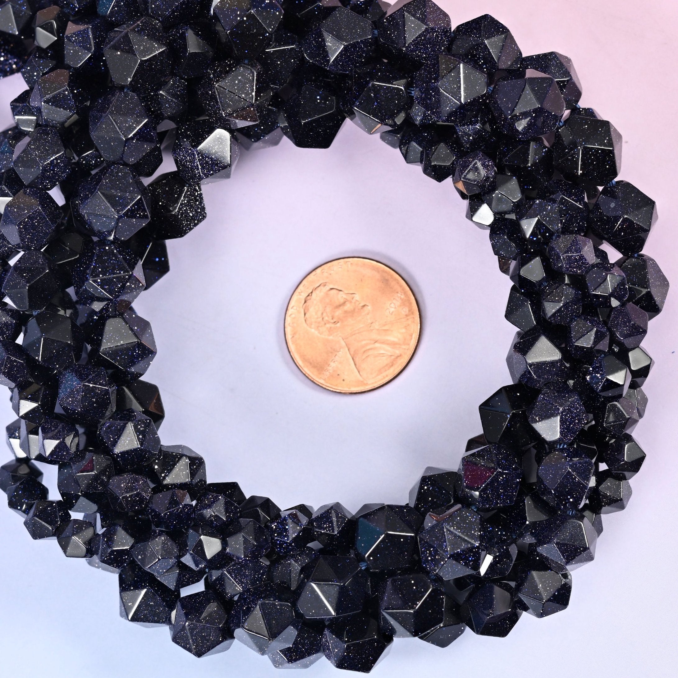 Strands coiled into a ring with a US penny at the centre for a clear size reference