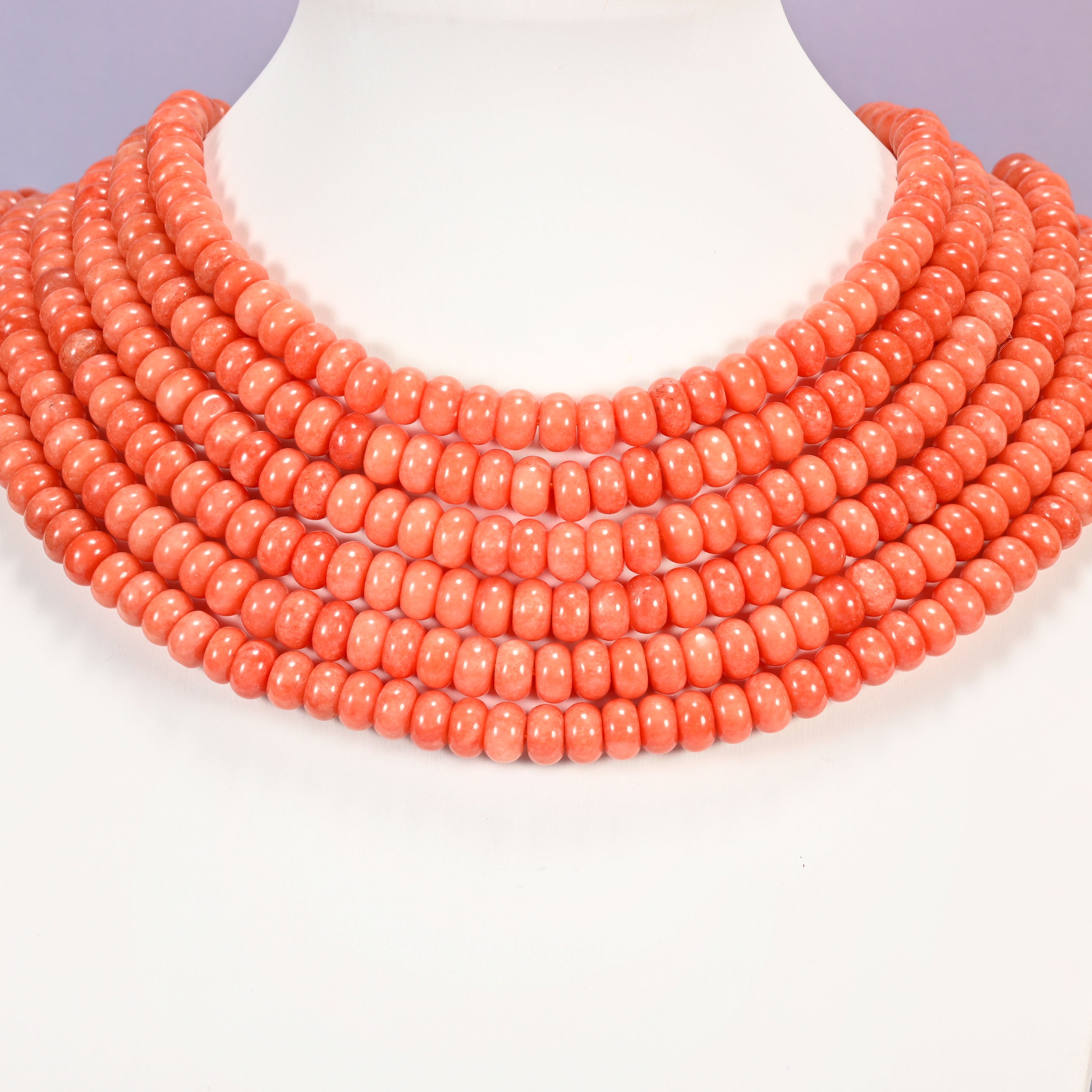 Red Orange dyed jade gemstone rondelle beads laid in graduated collar rows, 5x8mm discs in an even warm orange