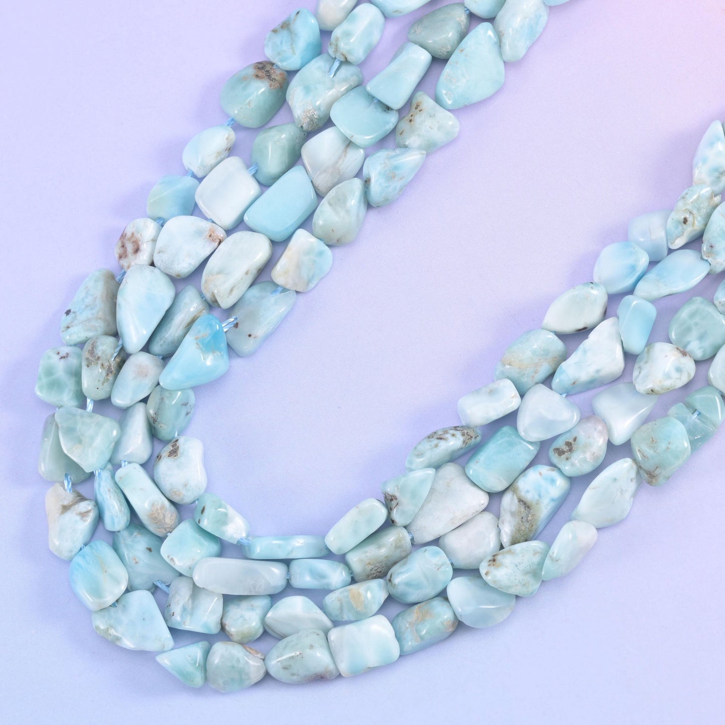Three strands curving together, chunkier nuggets on the outer row and smaller ones inside