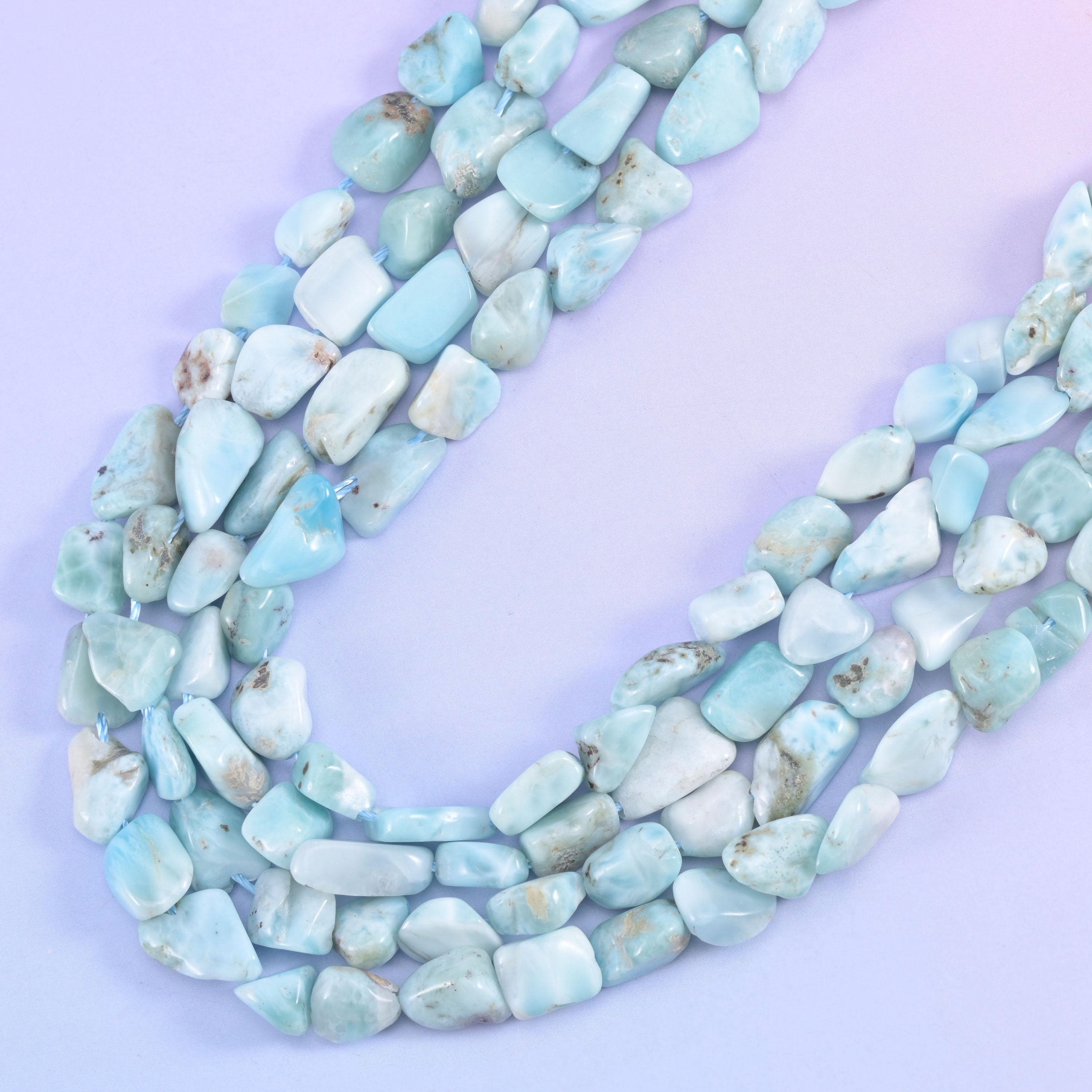 Three strands curving together, chunkier nuggets on the outer row and smaller ones inside